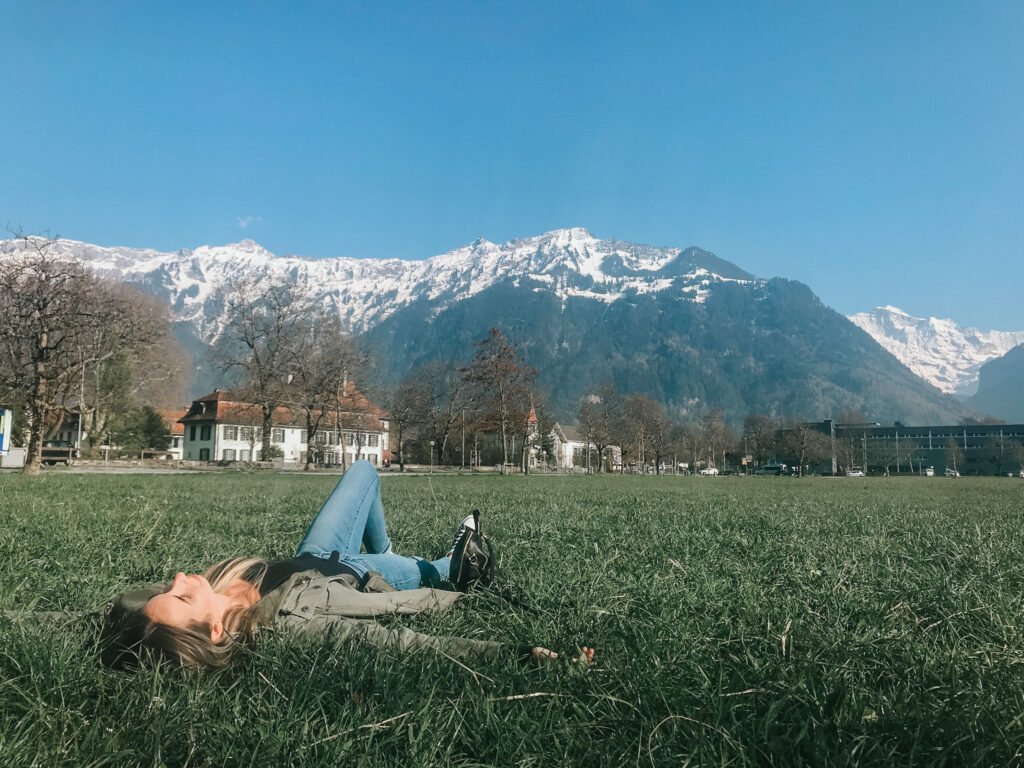 Laying in the park enjoying the views is a top thing to do in Interlaken