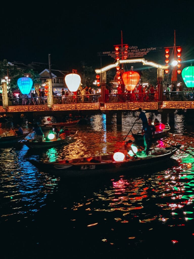 Laterns lit up on a boat floating down the river in Hoi An, Vietnam.