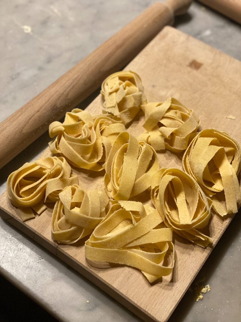 Making Pasta in an Italian cooking class offered as the palazzo leopoldo dimora storica & spa