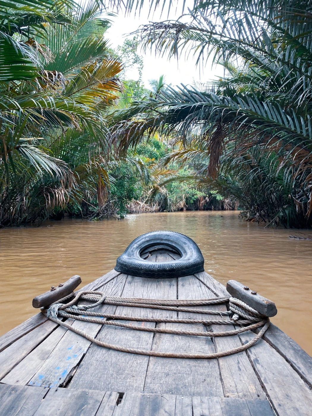 Riding on a traditional boat on the Mekong Delta in Vietnam