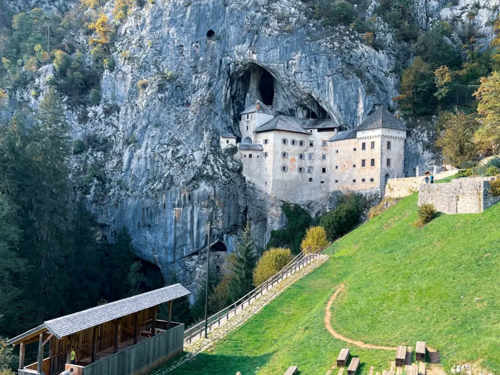 Predjama Castle is a must see during 4 days in Slovenia. It is a medieval castle that is built from the wall of a cave, so you see the entrance to the castle with the rest of the castle being in the cave. 