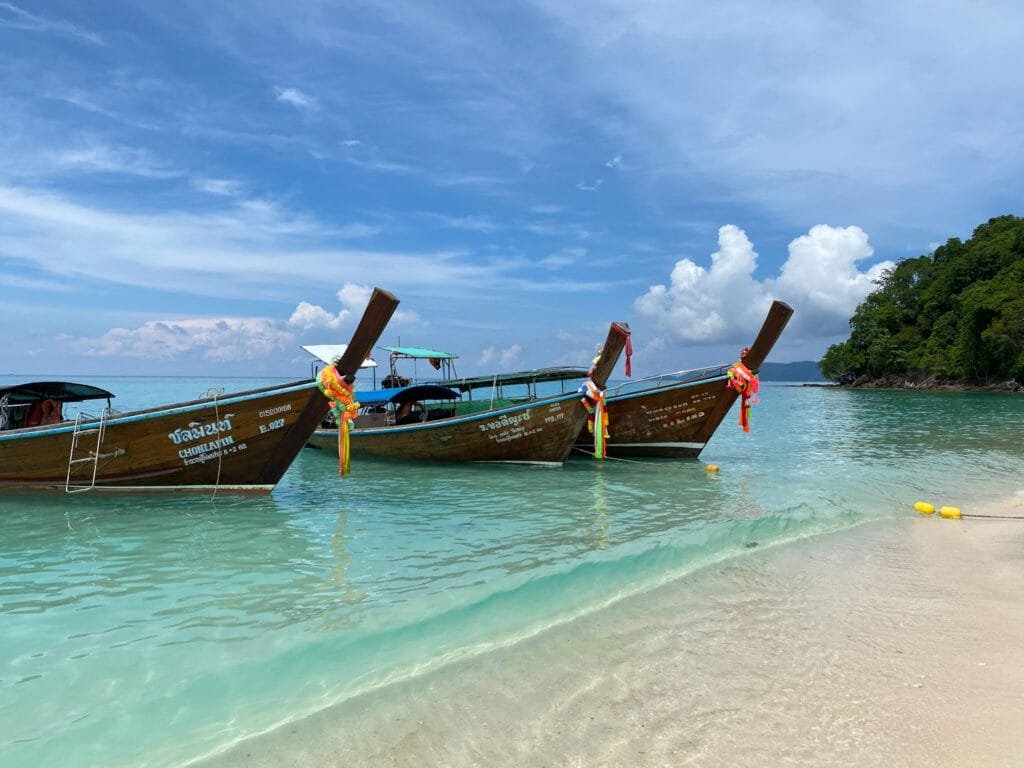 Longboats parked on the beach along Koh Phi Phi