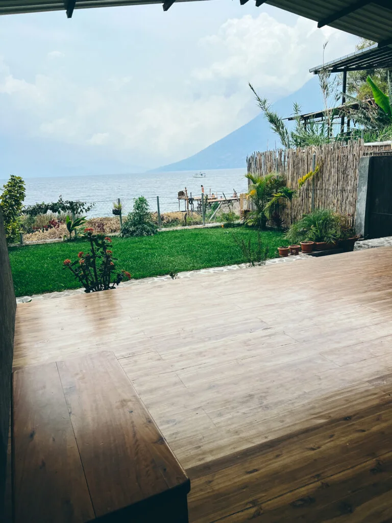 A yoga platform overlooking Lake Atitlan with the volcanoes in the background. A common view from San Marcos on a one week Guatemala itinerary.