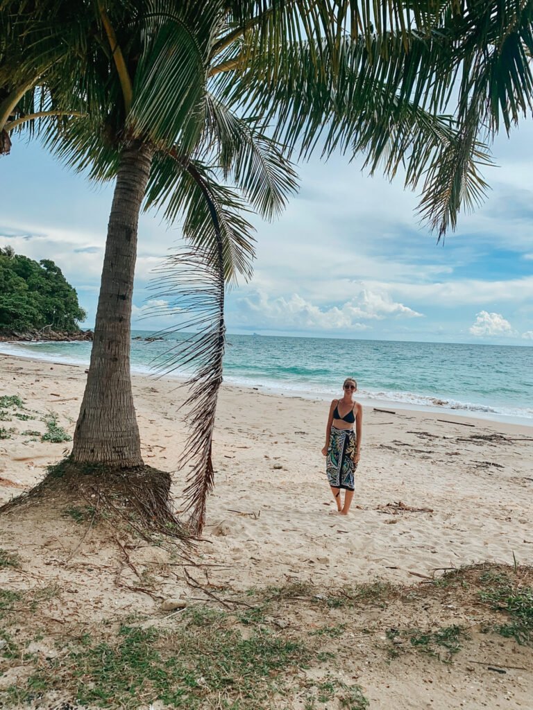 Enjoying the beach all to myself on Koh Lanta in Thailand. Wearing a sarong cover up from Thailand.