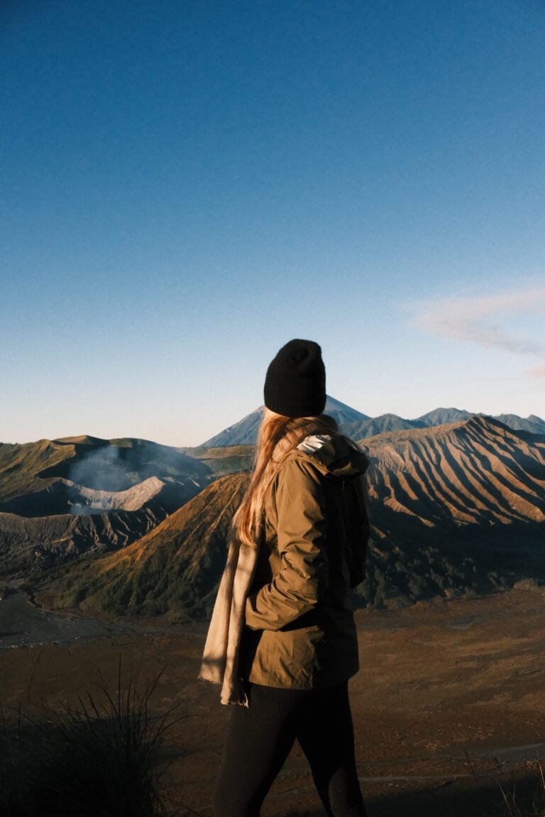 Traveler overlooking Mt. Bromo after sunrise