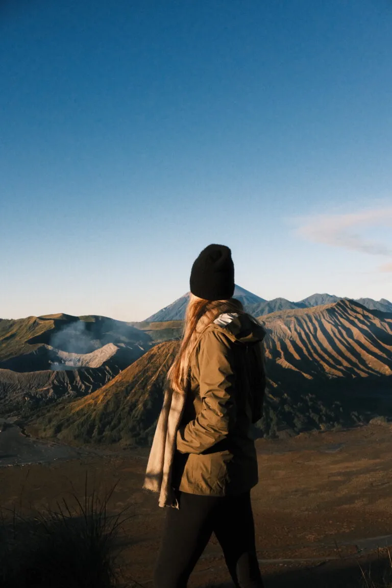 Traveler overlooking Mt. Bromo after sunrise