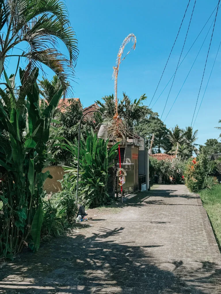 Balinese culture and greenery in front of a Balinese home